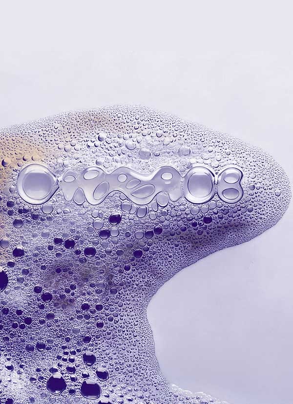 Purple soap bubbles on a smooth surface