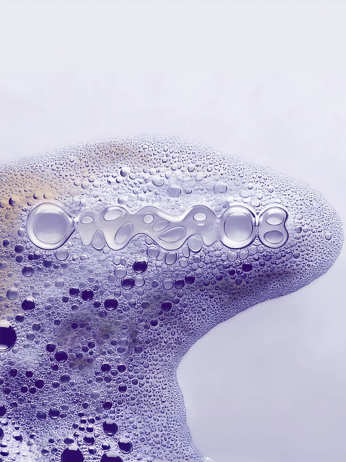 The DiNABIOS logo formed from bubbles in violet foam on a smooth surface