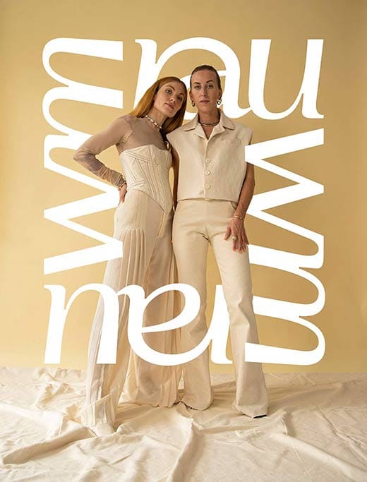 The two founders in cream in front of a golden backdrop with the rauwm lettering