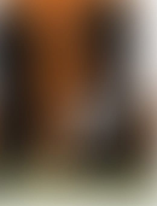 A blurred gradient in orange and black